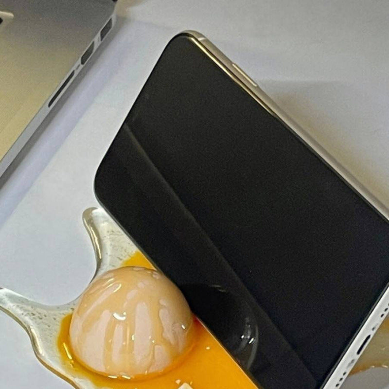 Suporte para celular em formato de ovo quebrado - Brinquedo de pegadinha com ovo quebrado e chá com leite derramado
