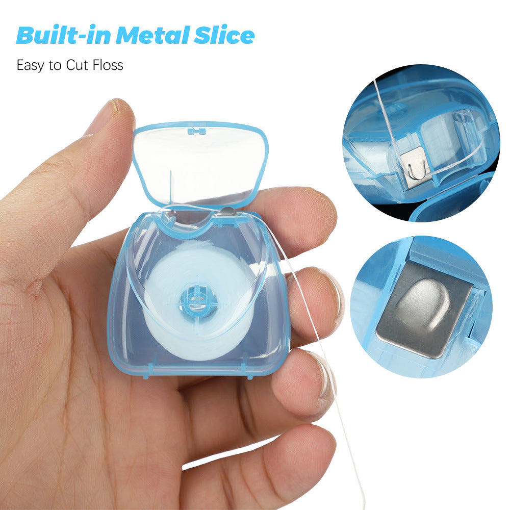 Fio dental descartável com sabor de menta, 50m, caixa triangular azul. Ideal para limpeza dos dentes. Rolo portátil de fio dental.