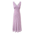 Vestido floral vintage sem mangas com decote em V e modelagem justa.
