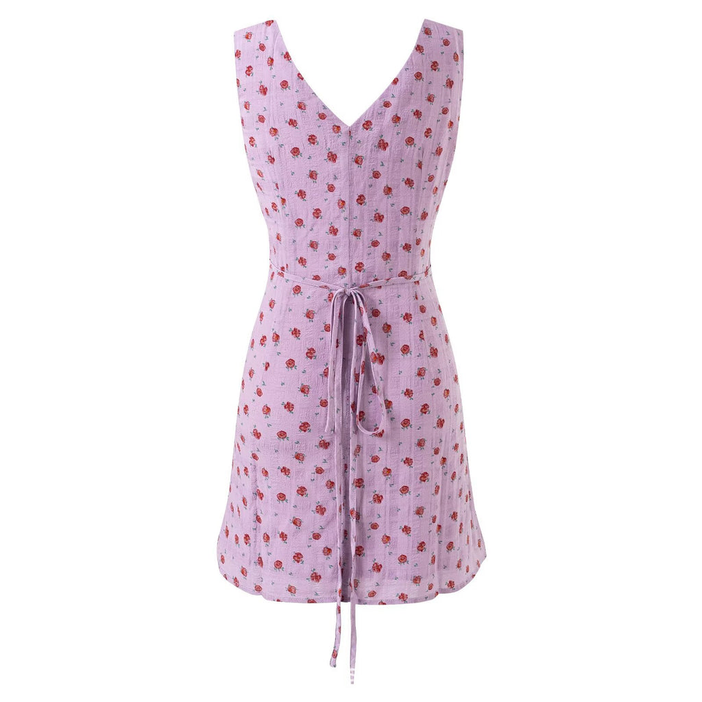 Vestido floral vintage sem mangas com decote em V e modelagem justa.