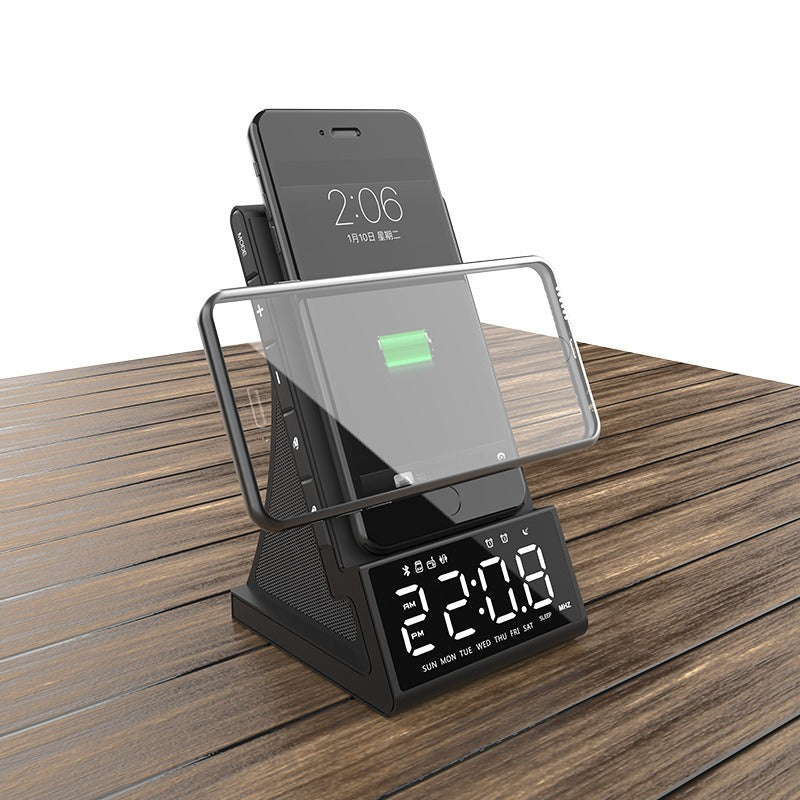 Carregador sem fio três em um, alto-falante Bluetooth, despertador com carregamento sem fio e suporte para celular.